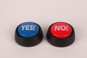 Image of vibrant blue and red push buttons labeled Yes and No against a plain background.